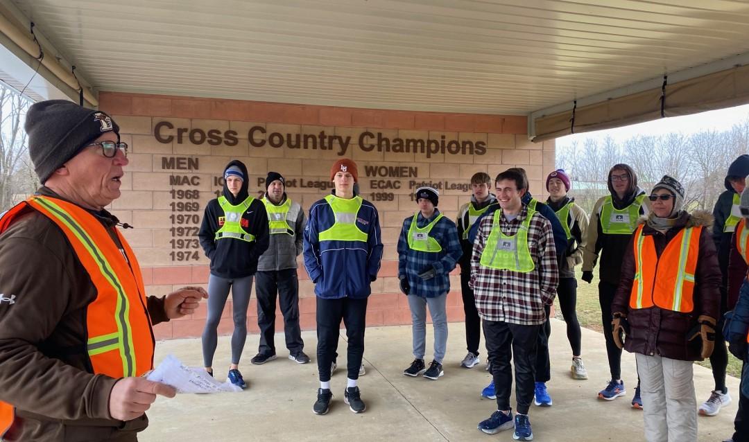 Paul Pagoda gives instructions to student and staff volunteers